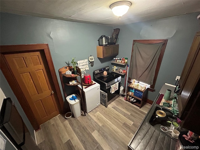 7 E Noble Ave, Monroe, MI 48162 - bedroom featuring light wood-style flooring and washer / clothes dryer