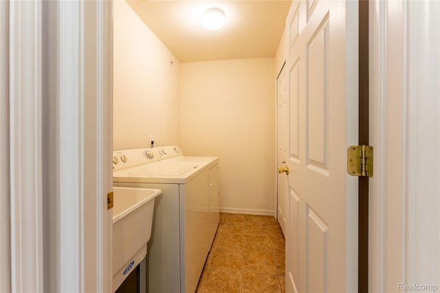 2165 Leighton Dr, Shelby Twp, MI 48317 - laundry room featuring washer and dryer and light tile patterned floors