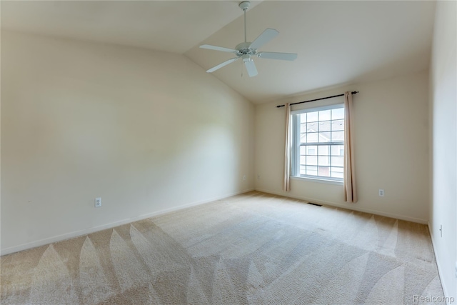 2165 Leighton Dr, Shelby Twp, MI 48317 - spare room featuring vaulted ceiling, a ceiling fan, and light colored carpet
