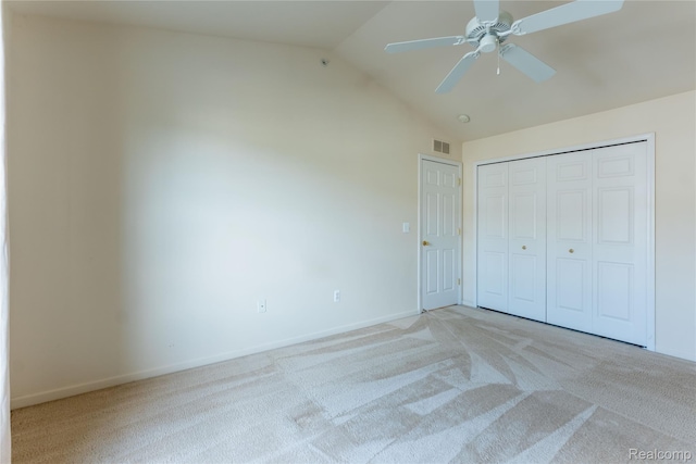 2165 Leighton Dr, Shelby Twp, MI 48317 - unfurnished bedroom with light colored carpet, lofted ceiling, a closet, and a ceiling fan