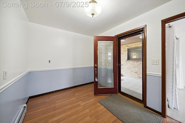 30590 Lorraine Ave, Warren, MI 48093 - unfurnished room with a baseboard heating unit and wood finished floors