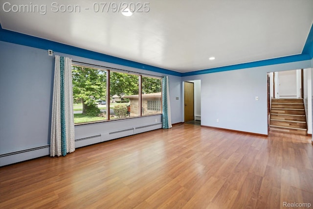 30590 Lorraine Ave, Warren, MI 48093 - spare room featuring stairway, wood finished floors, baseboard heating, and recessed lighting