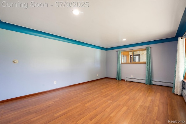 30590 Lorraine Ave, Warren, MI 48093 - spare room featuring light wood finished floors, baseboard heating, and recessed lighting
