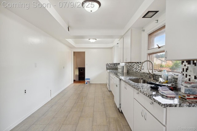 30590 Lorraine Ave, Warren, MI 48093 - kitchen with white cabinets, a raised ceiling, light stone countertops, and range