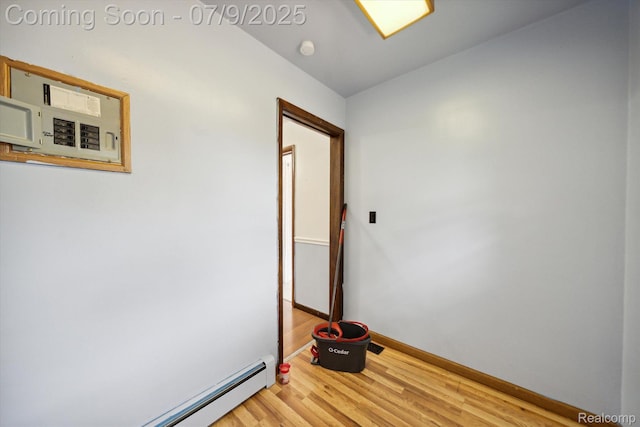 30590 Lorraine Ave, Warren, MI 48093 - spare room with baseboard heating, light wood-type flooring, and a smoke detector
