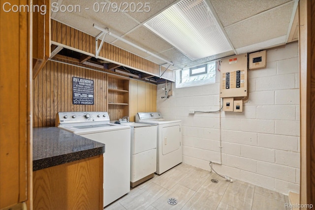 30590 Lorraine Ave, Warren, MI 48093 - laundry room featuring washer and dryer, concrete block wall, and electric panel
