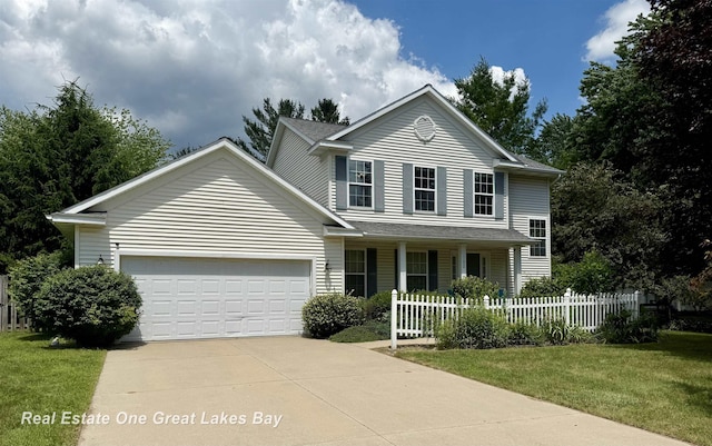 11540 Saddlebrook Cir, Freeland, MI 48623 - traditional-style house with an attached garage, driveway, and a porch