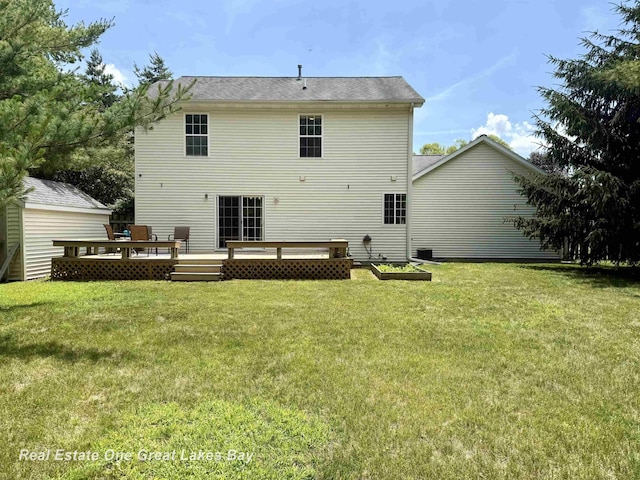 11540 Saddlebrook Cir, Freeland, MI 48623 - back of property featuring a wooden deck and a lawn