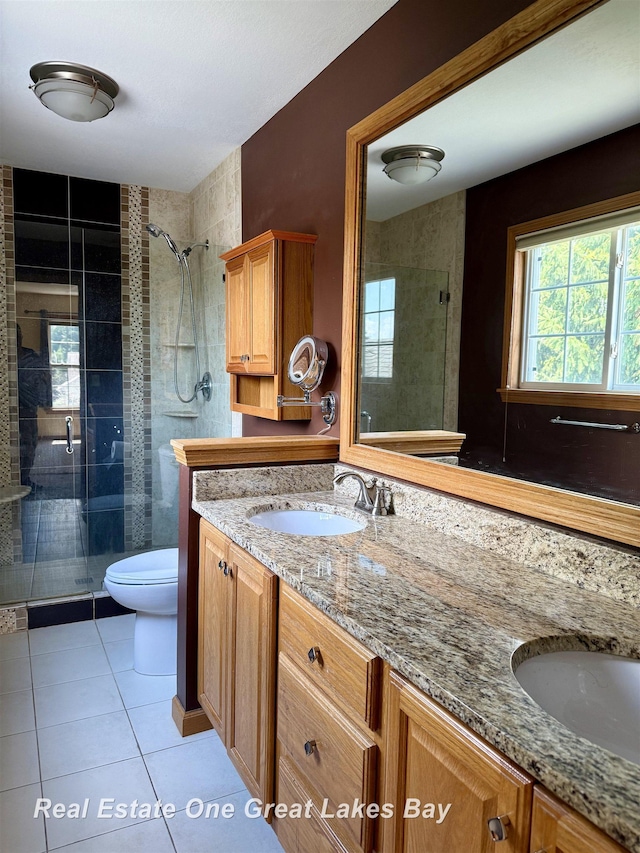 11540 Saddlebrook Cir, Freeland, MI 48623 - full bathroom with double vanity, a shower stall, and tile patterned flooring