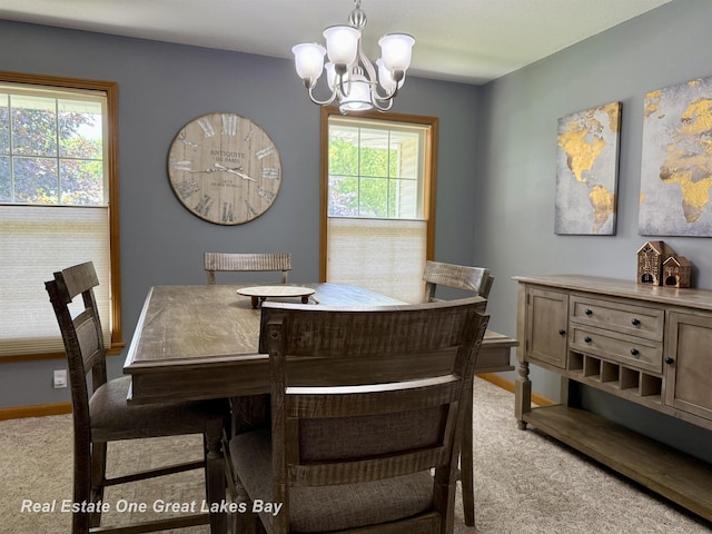 11540 Saddlebrook Cir, Freeland, MI 48623 - dining area featuring a chandelier and light carpet