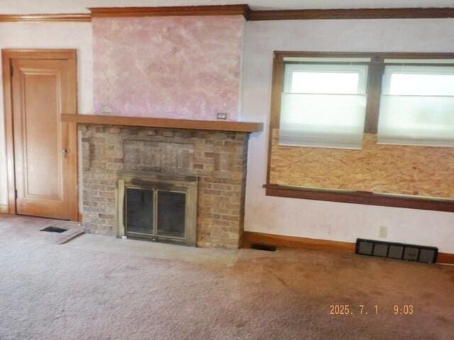 2535 Gull Rd, Kalamazoo, MI 49048 - unfurnished living room featuring a brick fireplace, carpet, and crown molding