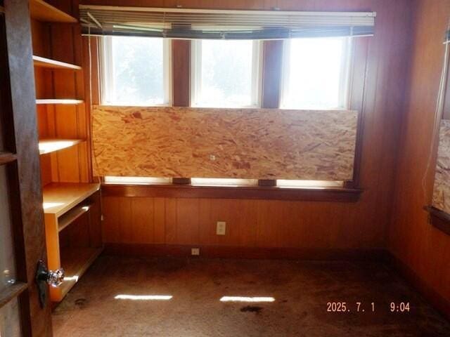 2535 Gull Rd, Kalamazoo, MI 49048 - spare room featuring wooden walls