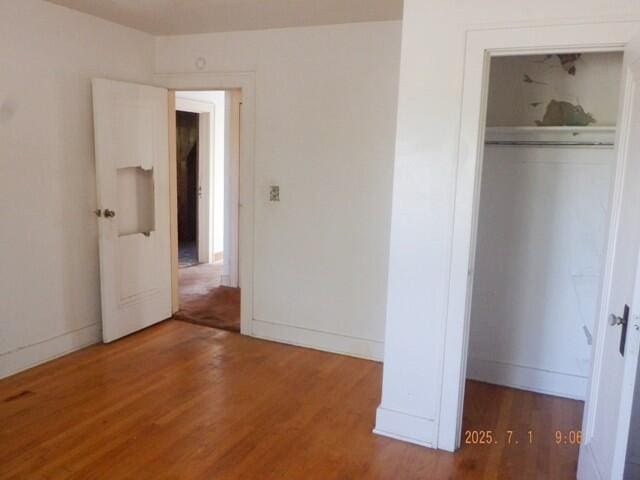 2535 Gull Rd, Kalamazoo, MI 49048 - unfurnished bedroom featuring wood finished floors and a closet