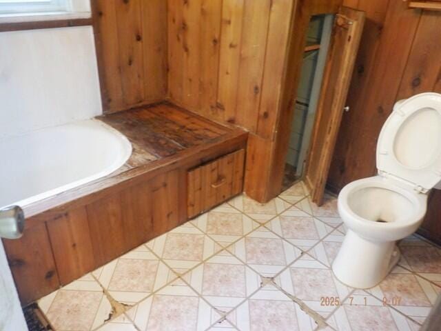 2535 Gull Rd, Kalamazoo, MI 49048 - full bath featuring wooden walls and toilet