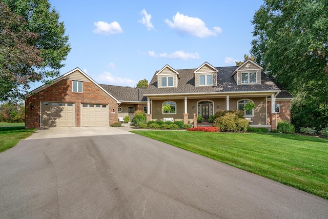 3603 Elk Ct, Zeeland, MI 49464 - cape cod-style house featuring asphalt driveway, brick siding, an attached garage, a front lawn, and a shingled roof