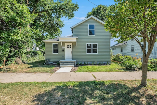 854 First St NW, Grand Rapids, MI 49504 - traditional-style house with a front yard