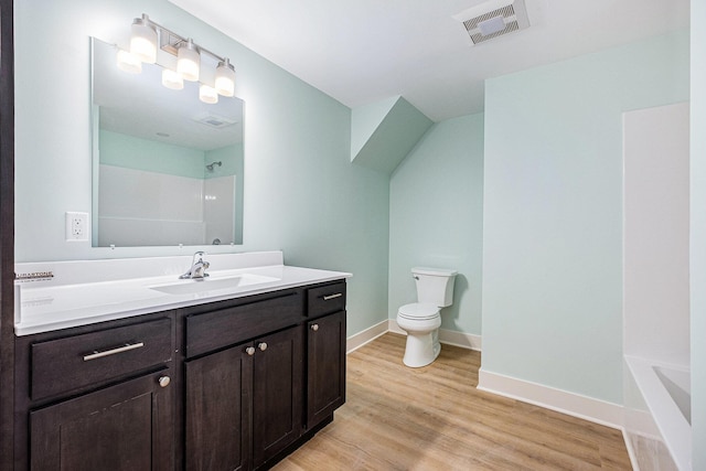854 First St NW, Grand Rapids, MI 49504 - full bathroom with vanity and wood finished floors