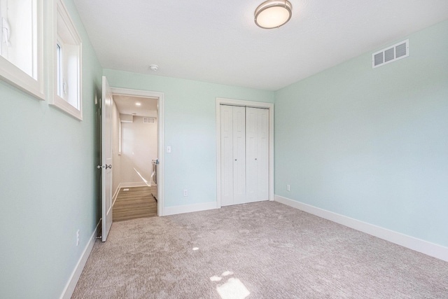 854 First St NW, Grand Rapids, MI 49504 - unfurnished bedroom with carpet floors and a closet