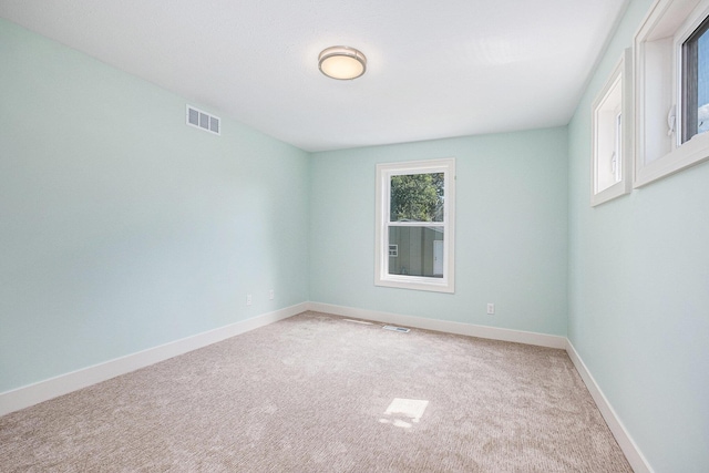 854 First St NW, Grand Rapids, MI 49504 - carpeted empty room featuring baseboards