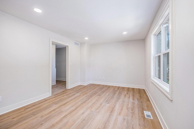 854 First St NW, Grand Rapids, MI 49504 - empty room with light wood-style floors and recessed lighting