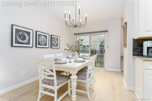 105 S 2nd St, Brighton, MI 48116 - dining room with a chandelier and light wood-style floors