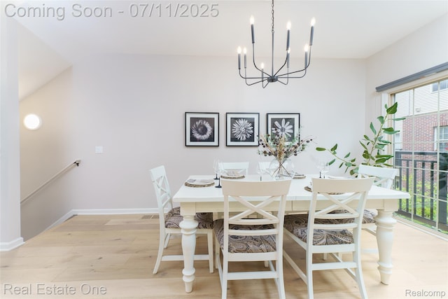 105 S 2nd St, Brighton, MI 48116 - dining room with plenty of natural light, a chandelier, and light wood finished floors