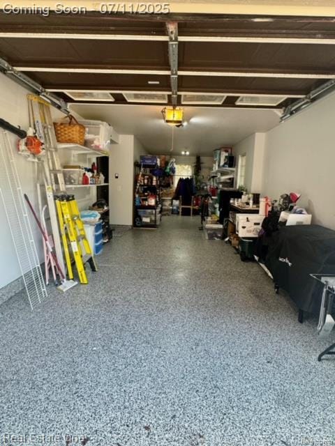 105 S 2nd St, Brighton, MI 48116 - garage featuring a garage door opener