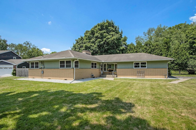 3715 Lancaster Dr, Kalamazoo, MI 49006 - view of front facade featuring a chimney and brick siding