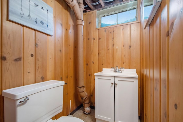 3715 Lancaster Dr, Kalamazoo, MI 49006 - half bathroom with wood walls and vanity