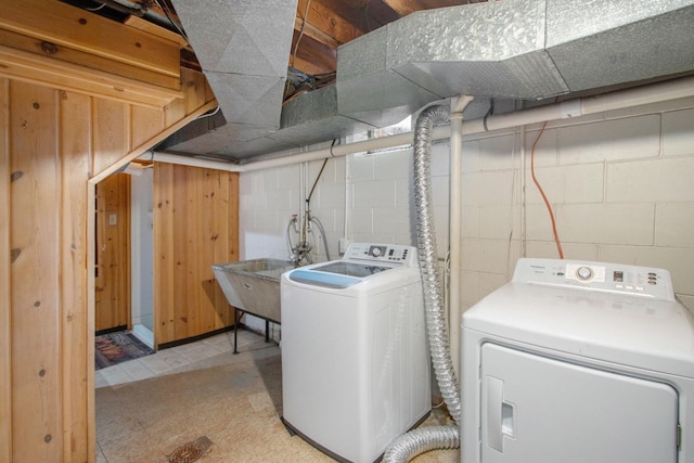 3715 Lancaster Dr, Kalamazoo, MI 49006 - washroom featuring washer and clothes dryer and concrete block wall
