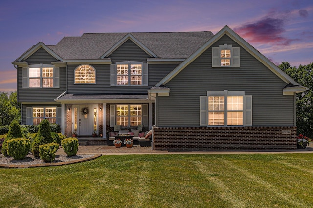5775 Libby Ct, Dexter, MI 48130 - view of front facade featuring brick siding and a front lawn