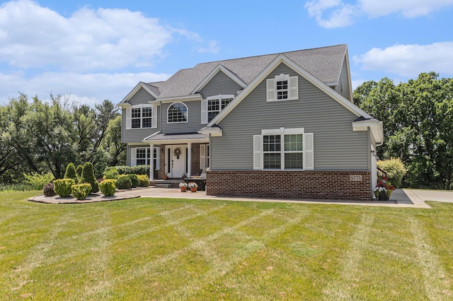 5775 Libby Ct, Dexter, MI 48130 - view of front of home with brick siding, a front yard, and covered porch