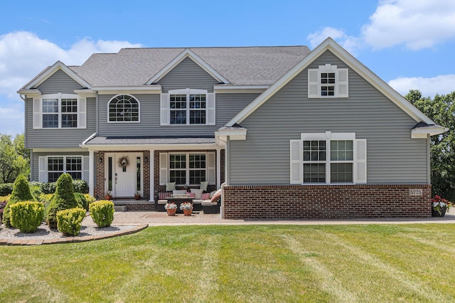 5775 Libby Ct, Dexter, MI 48130 - traditional-style home featuring brick siding, a front lawn, and a shingled roof