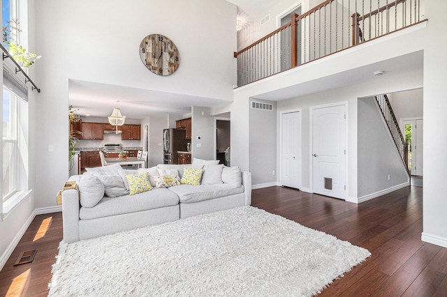 5775 Libby Ct, Dexter, MI 48130 - living room with a towering ceiling and dark wood-type flooring