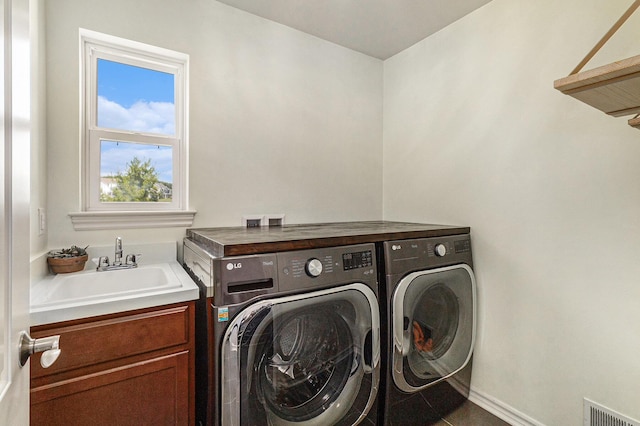 5775 Libby Ct, Dexter, MI 48130 - laundry area featuring washer and dryer and cabinet space
