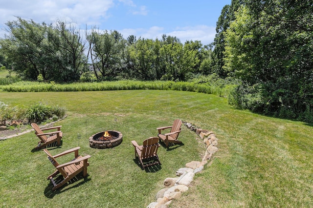5775 Libby Ct, Dexter, MI 48130 - view of green lawn with a fire pit
