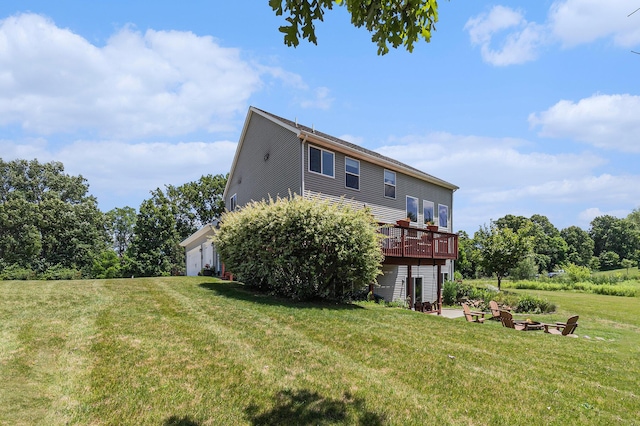 5775 Libby Ct, Dexter, MI 48130 - rear view of house featuring a yard, a deck, and a fire pit