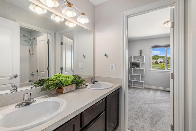 5775 Libby Ct, Dexter, MI 48130 - bathroom with double vanity and shower / tub combination