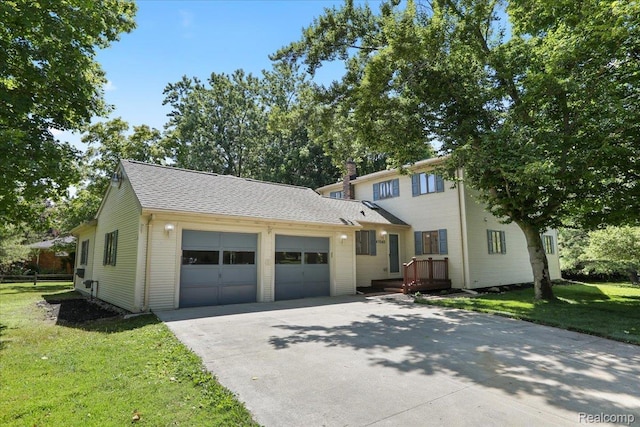 47043 Curtis Rd, Northville, MI 48168 - view of front of home featuring a garage, concrete driveway, a front yard, a chimney, and a shingled roof