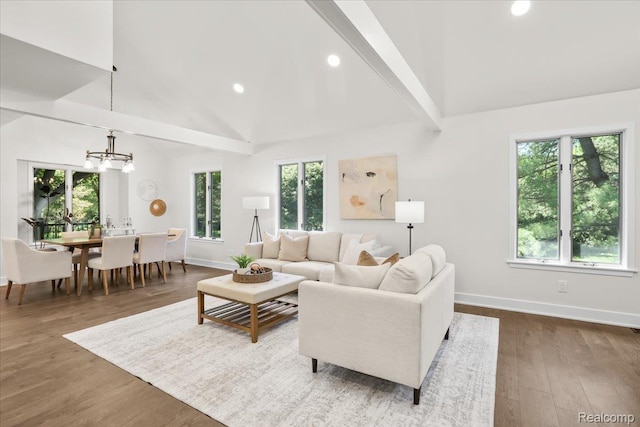 47043 Curtis Rd, Northville, MI 48168 - living room with a chandelier, recessed lighting, dark wood finished floors, high vaulted ceiling, and beam ceiling