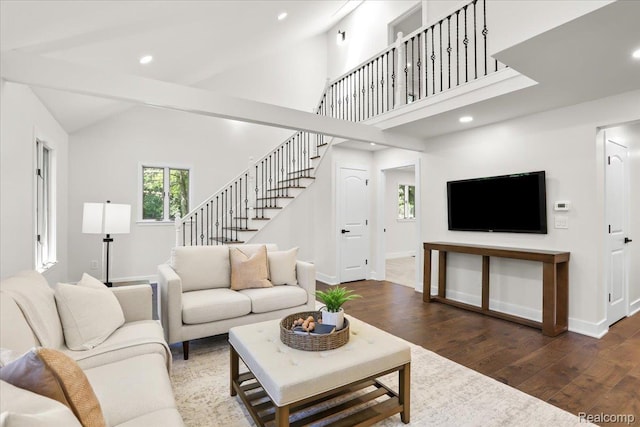 47043 Curtis Rd, Northville, MI 48168 - living room with stairs, wood finished floors, recessed lighting, and vaulted ceiling