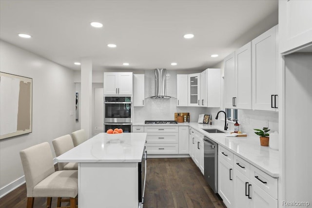 47043 Curtis Rd, Northville, MI 48168 - kitchen featuring wall chimney range hood, stainless steel appliances, a kitchen island, a breakfast bar, and light stone counters