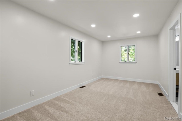 47043 Curtis Rd, Northville, MI 48168 - spare room featuring light carpet and recessed lighting