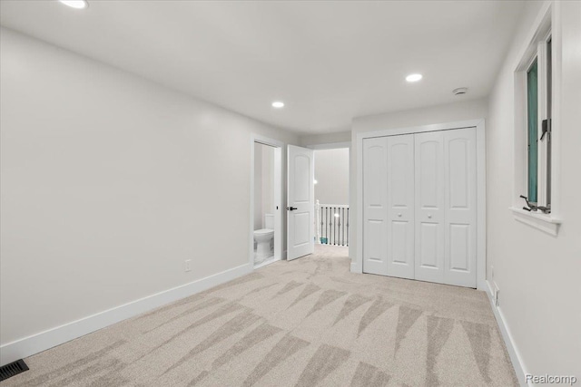 47043 Curtis Rd, Northville, MI 48168 - unfurnished bedroom with recessed lighting, carpet flooring, a closet, and connected bathroom