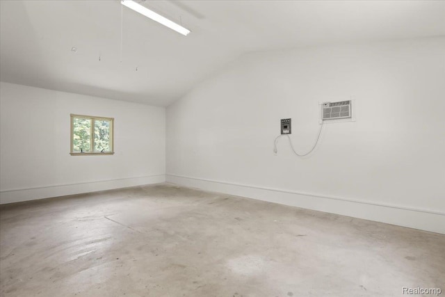 47043 Curtis Rd, Northville, MI 48168 - unfurnished room with concrete flooring, vaulted ceiling, and a wall mounted AC