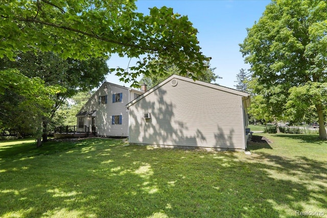 47043 Curtis Rd, Northville, MI 48168 - view of side of home featuring a wooden deck and a lawn