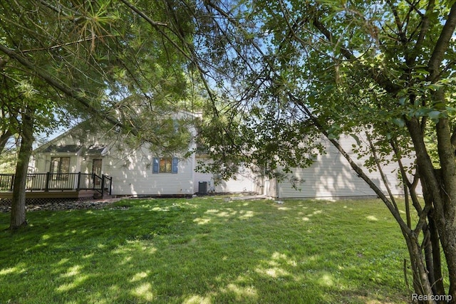 47043 Curtis Rd, Northville, MI 48168 - view of grassy yard with a deck