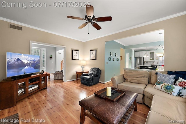 3066 Waldon Park Dr, Orion, MI 48359 - living room featuring light wood-style floors, a ceiling fan, and ornamental molding