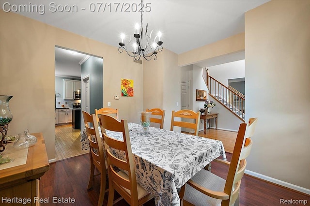 3066 Waldon Park Dr, Orion, MI 48359 - dining space featuring a chandelier, wood finished floors, and stairway