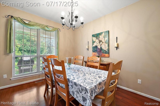 3066 Waldon Park Dr, Orion, MI 48359 - dining space featuring a chandelier and wood finished floors